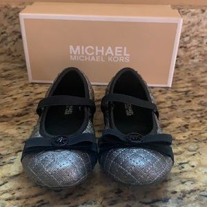 Michael Kors gunmetal and black maryjanes.